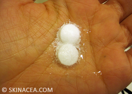 Aspirin dissolving in water